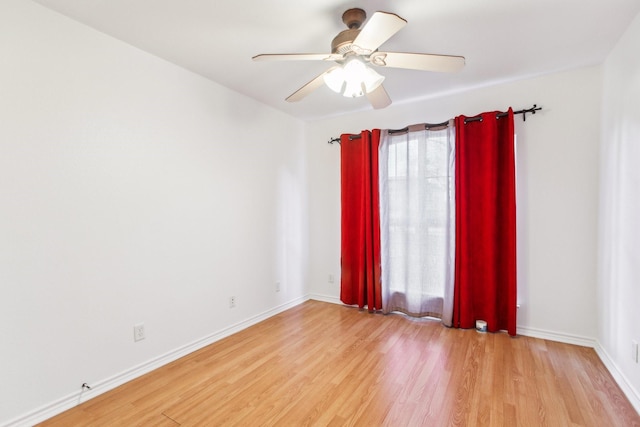 spare room with ceiling fan and light hardwood / wood-style floors