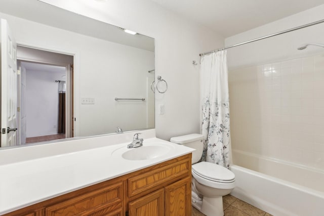 full bathroom with vanity, tile patterned flooring, toilet, and shower / bath combo with shower curtain