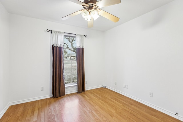 unfurnished room with ceiling fan and light wood-type flooring