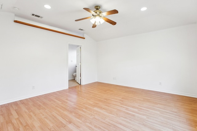 unfurnished room featuring ceiling fan, lofted ceiling, and light hardwood / wood-style floors