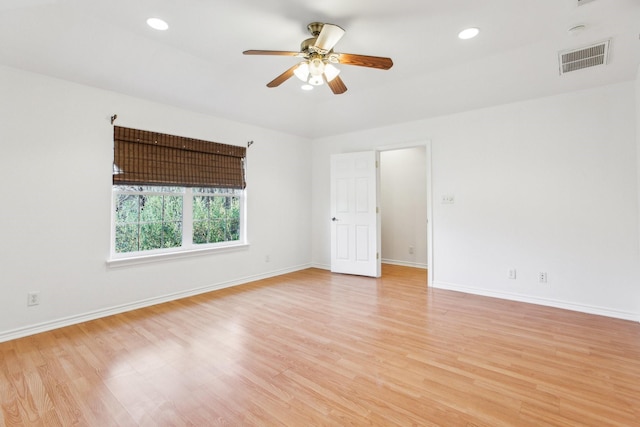 spare room with ceiling fan and light hardwood / wood-style flooring