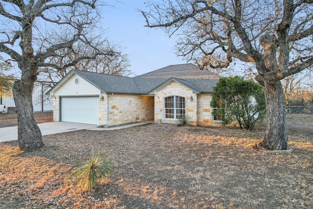 ranch-style home featuring a garage