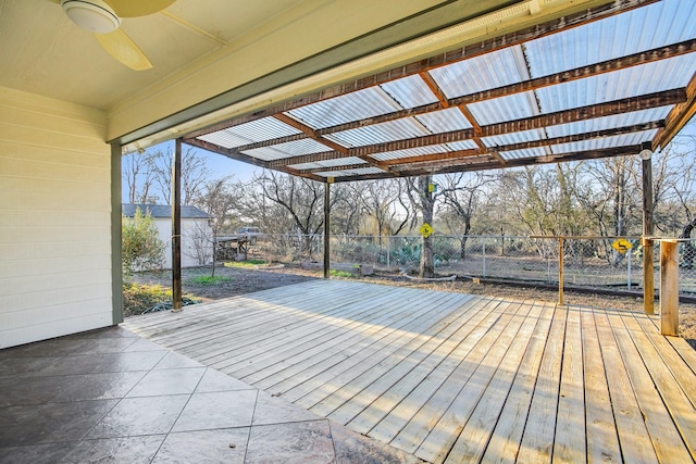 wooden terrace featuring ceiling fan