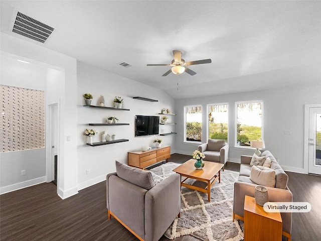 living room featuring dark hardwood / wood-style flooring and ceiling fan