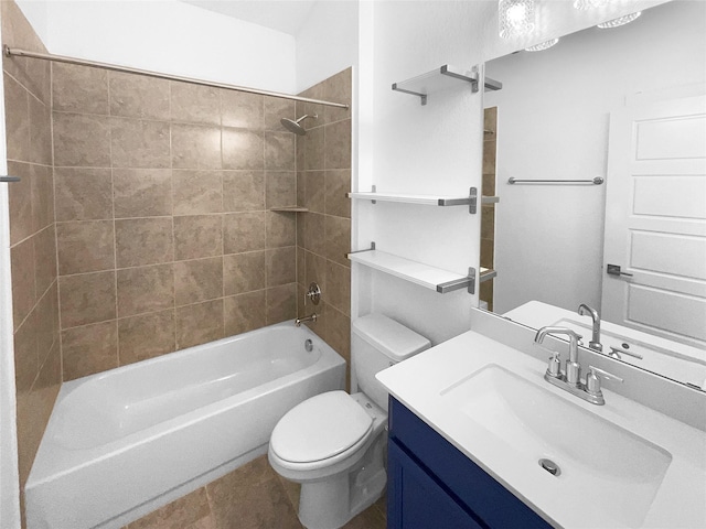 full bathroom with tiled shower / bath, vanity, tile patterned floors, and toilet