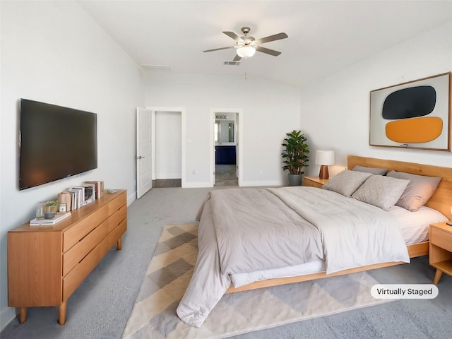 bedroom with vaulted ceiling, light carpet, and ceiling fan