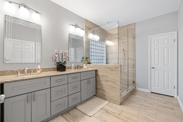 bathroom with walk in shower and vanity