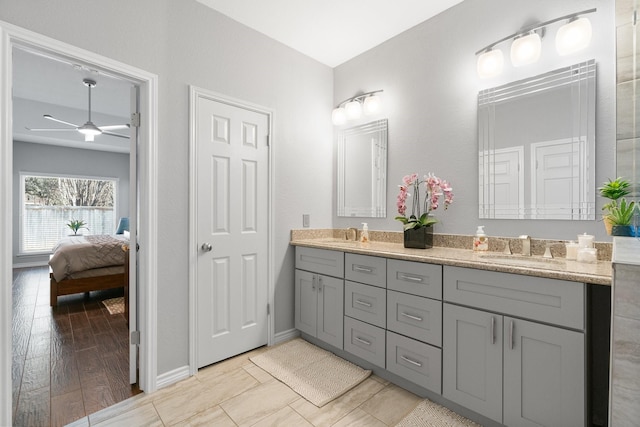 bathroom featuring ceiling fan, vanity, and hardwood / wood-style floors