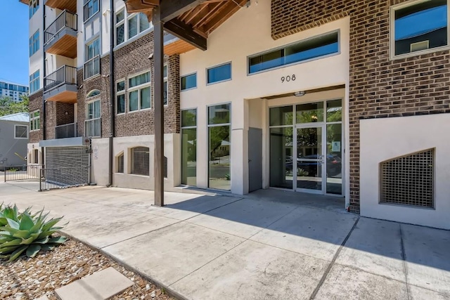 908 Nueces St Unit 37, Austin, TX 78701 - entrance to property featuring brick siding and stucco siding