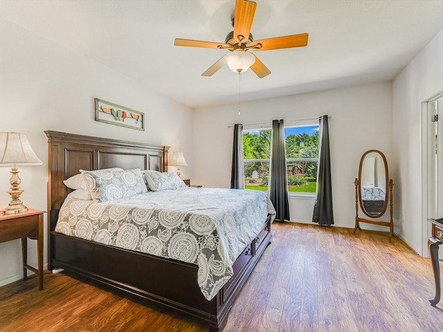 bedroom with light wood-type flooring and ceiling fan