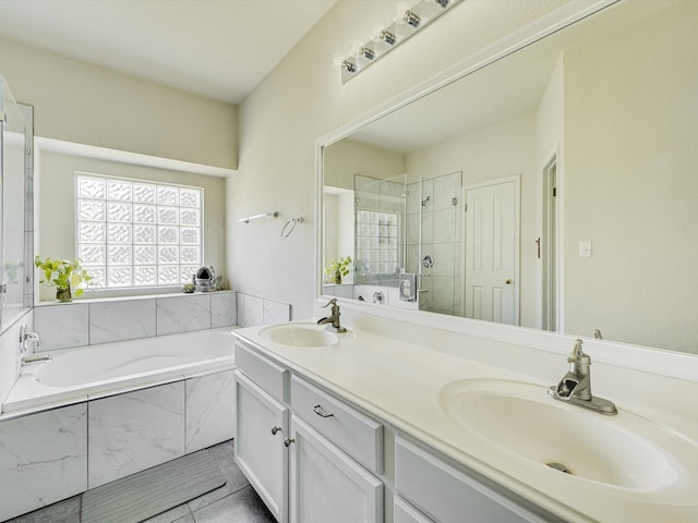 bathroom with tile patterned flooring, vanity, and separate shower and tub