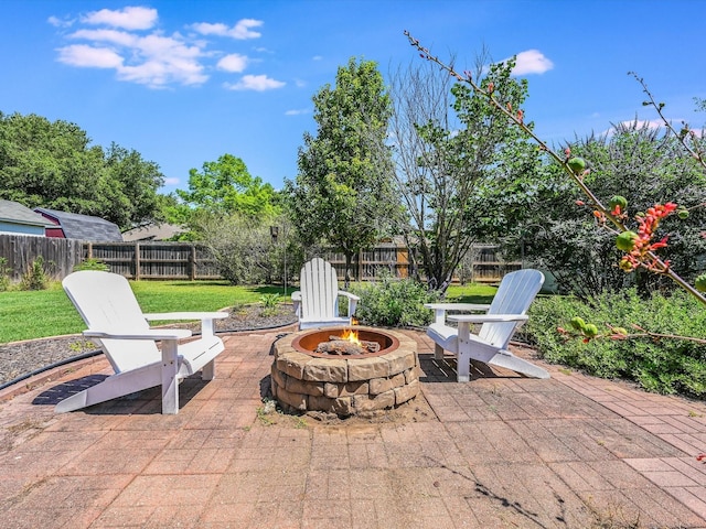 view of patio / terrace with an outdoor fire pit