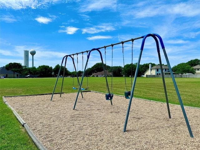 view of jungle gym featuring a lawn