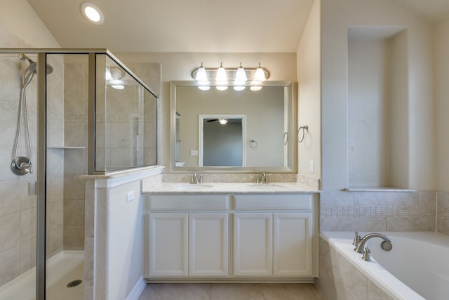 bathroom with tile patterned flooring, vanity, separate shower and tub, and lofted ceiling