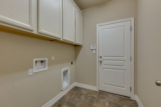 laundry area with electric dryer hookup, washer hookup, cabinets, and gas dryer hookup