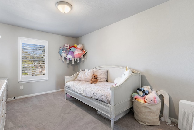 bedroom featuring light colored carpet