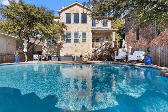 view of pool featuring grilling area