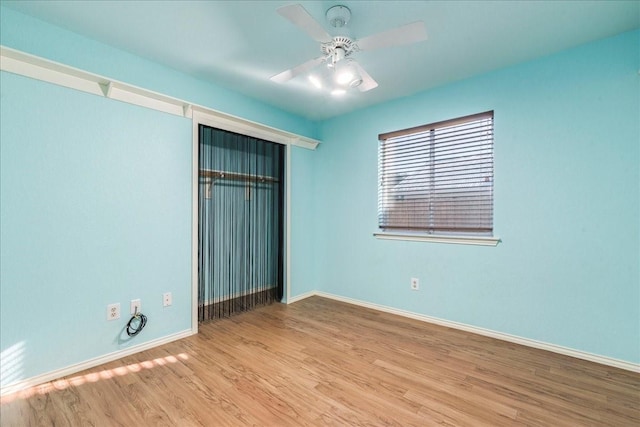 unfurnished bedroom with a closet, ceiling fan, and light hardwood / wood-style flooring