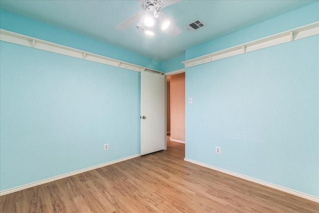 unfurnished room featuring ceiling fan and light hardwood / wood-style floors