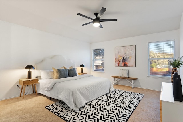 bedroom with light colored carpet and ceiling fan