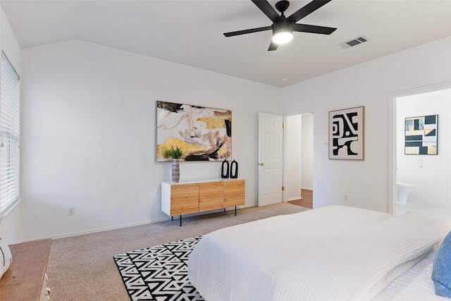 carpeted bedroom featuring ceiling fan and ensuite bathroom