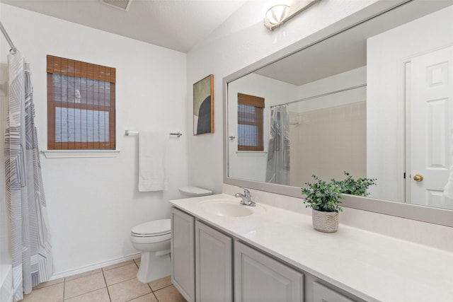 full bathroom featuring shower / bath combination with curtain, tile patterned floors, vanity, and toilet