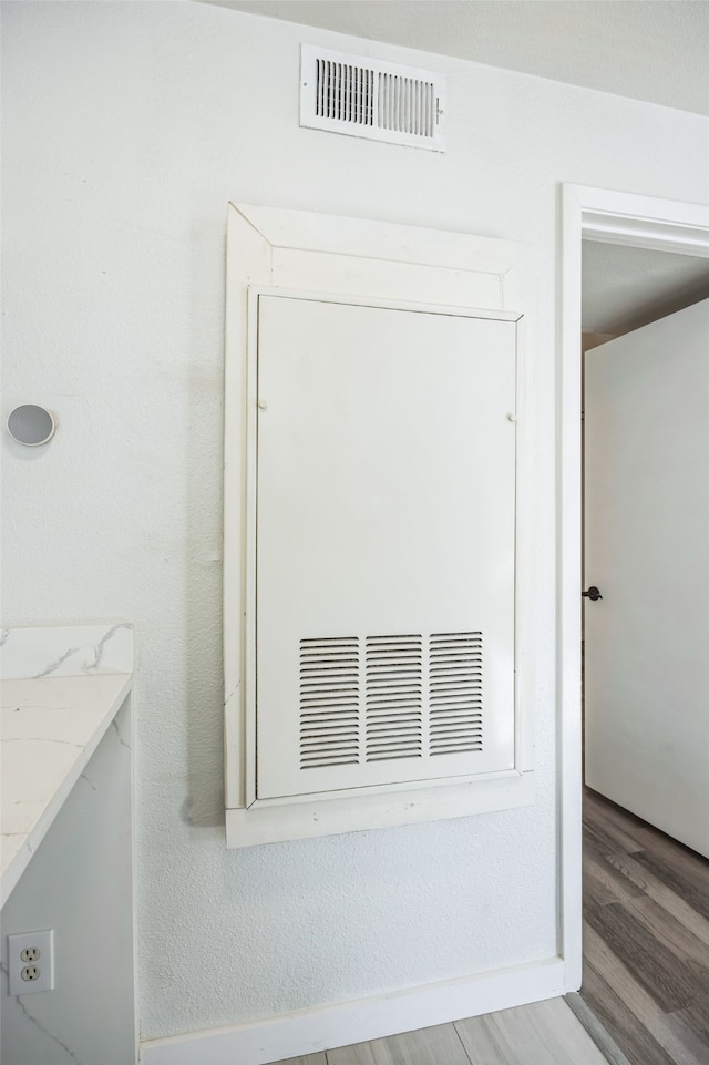 interior details with hardwood / wood-style flooring