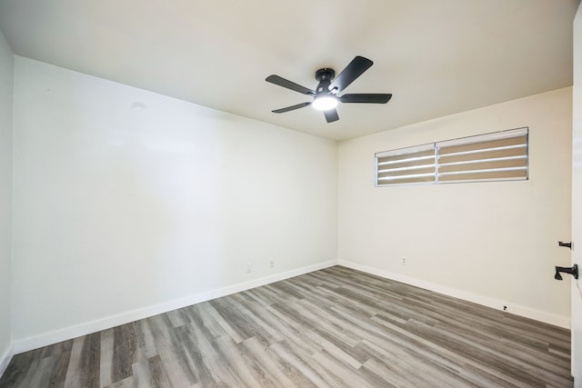 unfurnished room with hardwood / wood-style flooring and ceiling fan