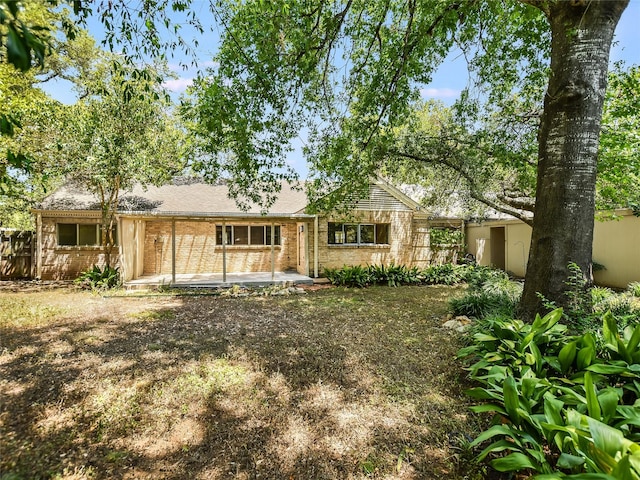 rear view of property with a patio area