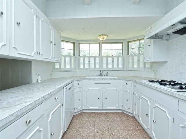 kitchen featuring white appliances, custom range hood, and white cabinets