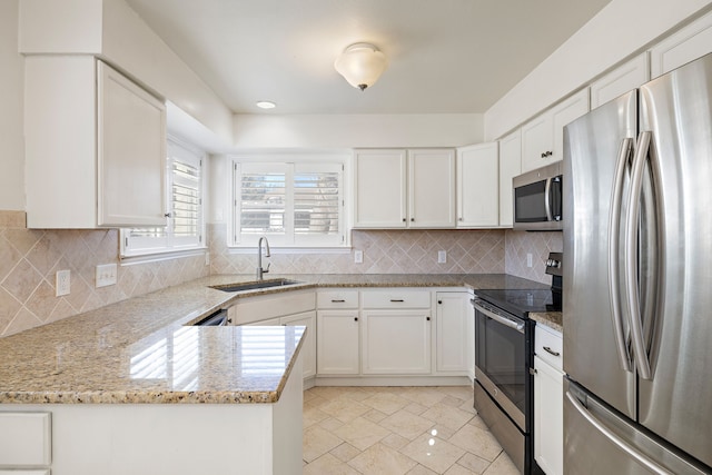 kitchen with white cabinetry, sink, and appliances with stainless steel finishes