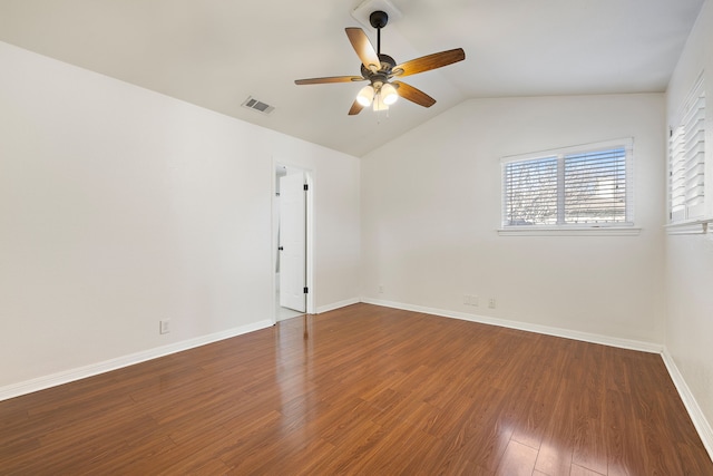 spare room featuring wood-type flooring, ceiling fan, and vaulted ceiling