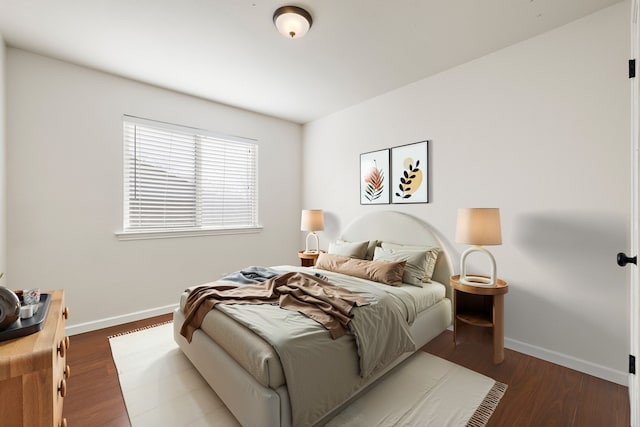 bedroom featuring dark hardwood / wood-style flooring