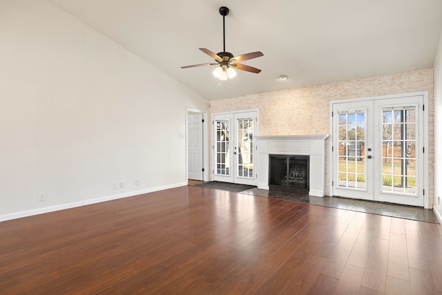 unfurnished living room with ceiling fan, dark hardwood / wood-style flooring, and french doors