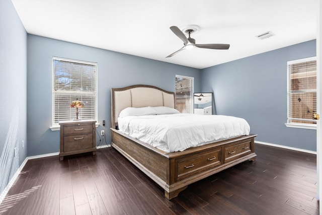 bedroom featuring dark hardwood / wood-style flooring and ceiling fan