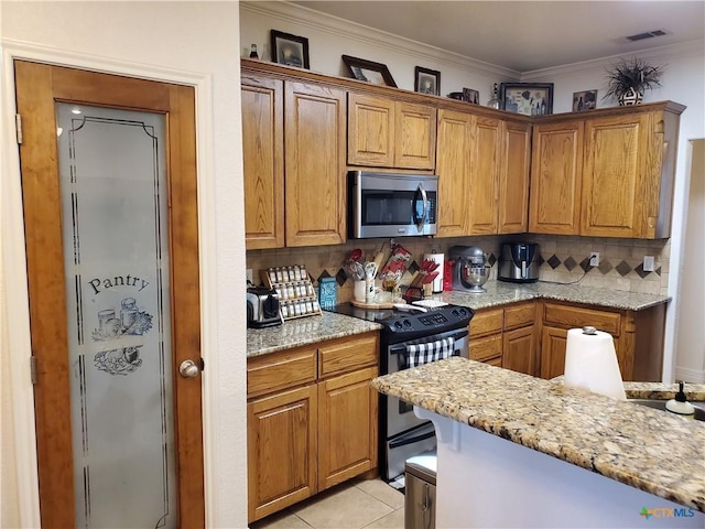 kitchen featuring light tile patterned floors, ornamental molding, stainless steel appliances, light stone countertops, and backsplash