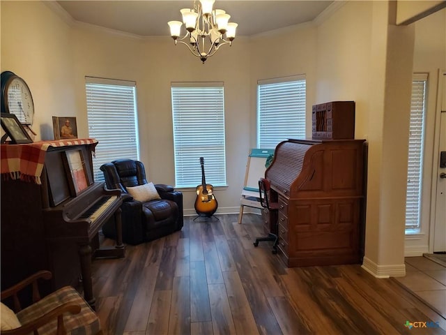 sitting room with crown molding, dark wood-type flooring, and a chandelier