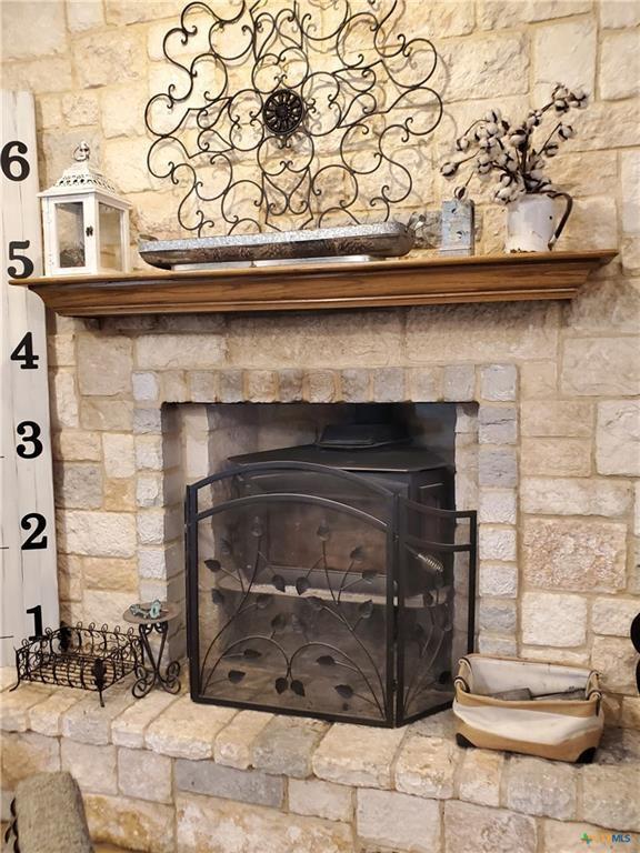 room details with a stone fireplace