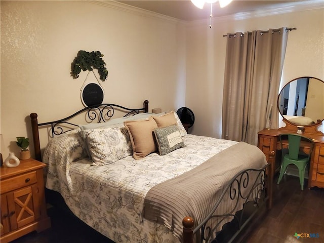 bedroom with ornamental molding and dark hardwood / wood-style floors