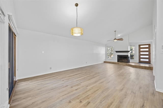 unfurnished living room featuring ceiling fan, high vaulted ceiling, and light hardwood / wood-style floors