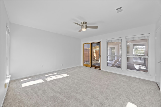 carpeted empty room featuring ceiling fan