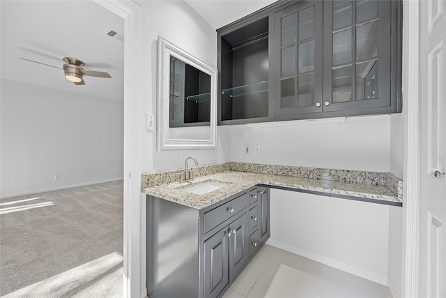 bathroom with ceiling fan and vanity