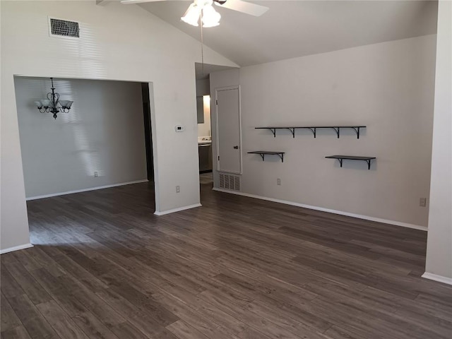 unfurnished living room featuring high vaulted ceiling, ceiling fan with notable chandelier, and dark hardwood / wood-style flooring