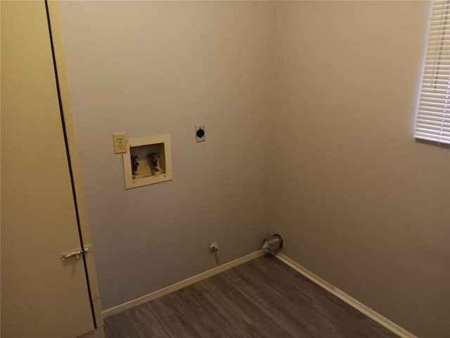 clothes washing area featuring hardwood / wood-style flooring, washer hookup, gas dryer hookup, and electric dryer hookup