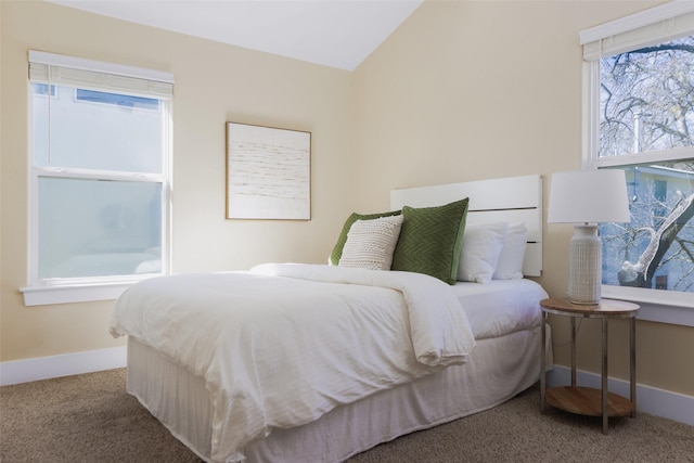 carpeted bedroom with vaulted ceiling