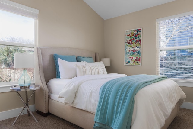 carpeted bedroom featuring lofted ceiling