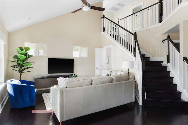 living room featuring wood-type flooring, ceiling fan, and high vaulted ceiling