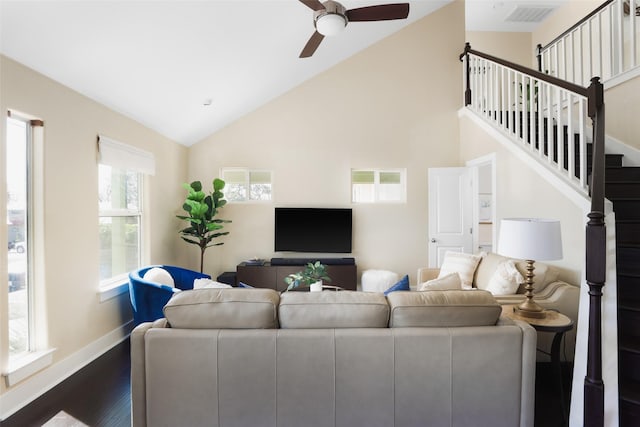 living room featuring vaulted ceiling, ceiling fan, and dark hardwood / wood-style flooring