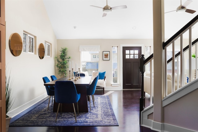 dining area featuring ceiling fan, lofted ceiling, and dark hardwood / wood-style floors