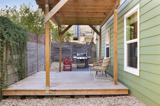 wooden deck featuring grilling area